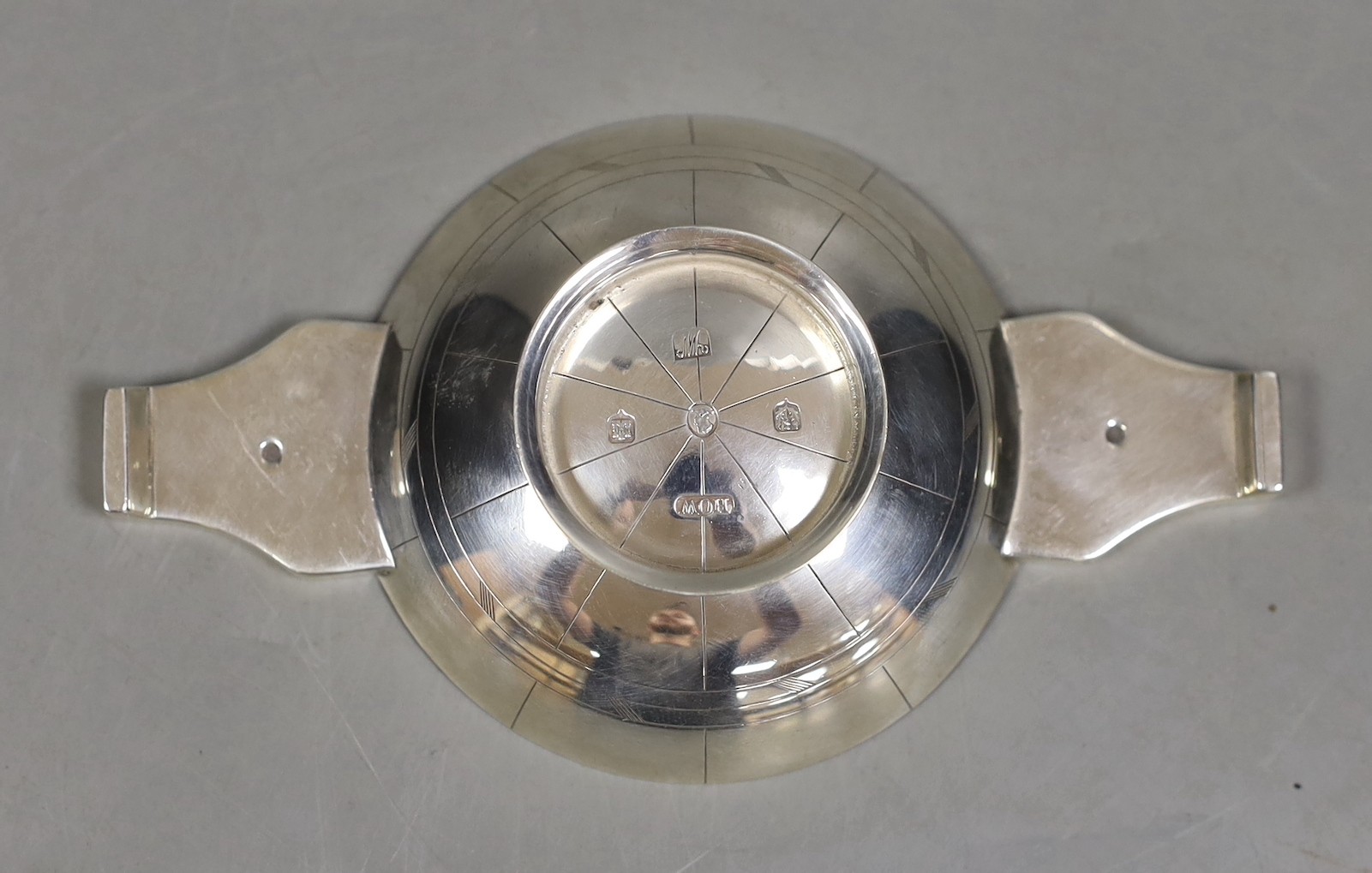 A mid 20th century Scottish silver quaich, engraved with the signs of the zodiac, George Evelyn Paget How, Edinburgh, 1952, 12.8cm, 76 grams.